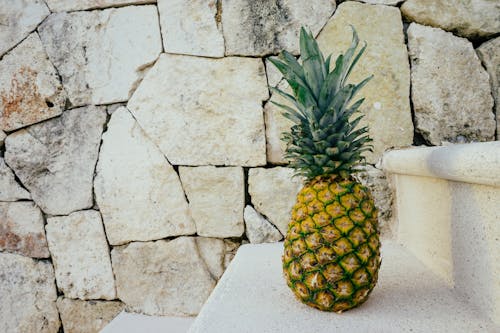 Free Pineapple on White Stairs Stock Photo