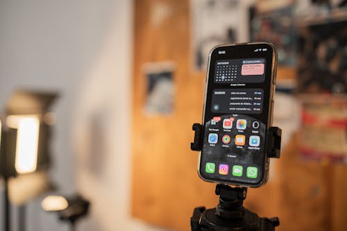 Free Cellphone on a Phone Holder  Stock Photo