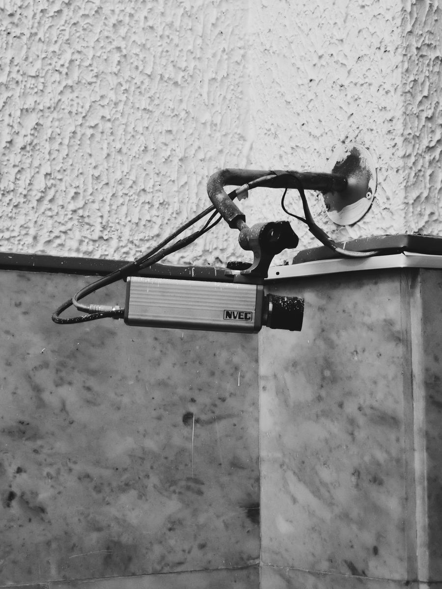 Security camera mounted on exterior wall