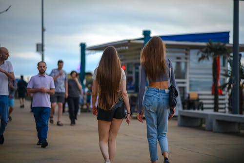 Women Walking on the Sidewalk