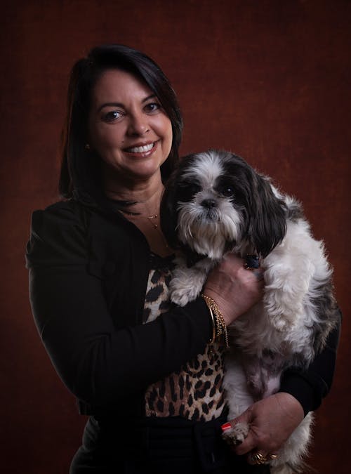 Woman with a Dog Posing in a Studio