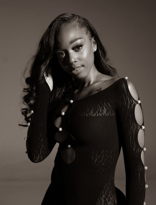 Black and White Photo of a Beautiful Woman Wearing a Dress