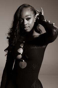 Stylish monochrome portrait of a woman in a fashionable dress.