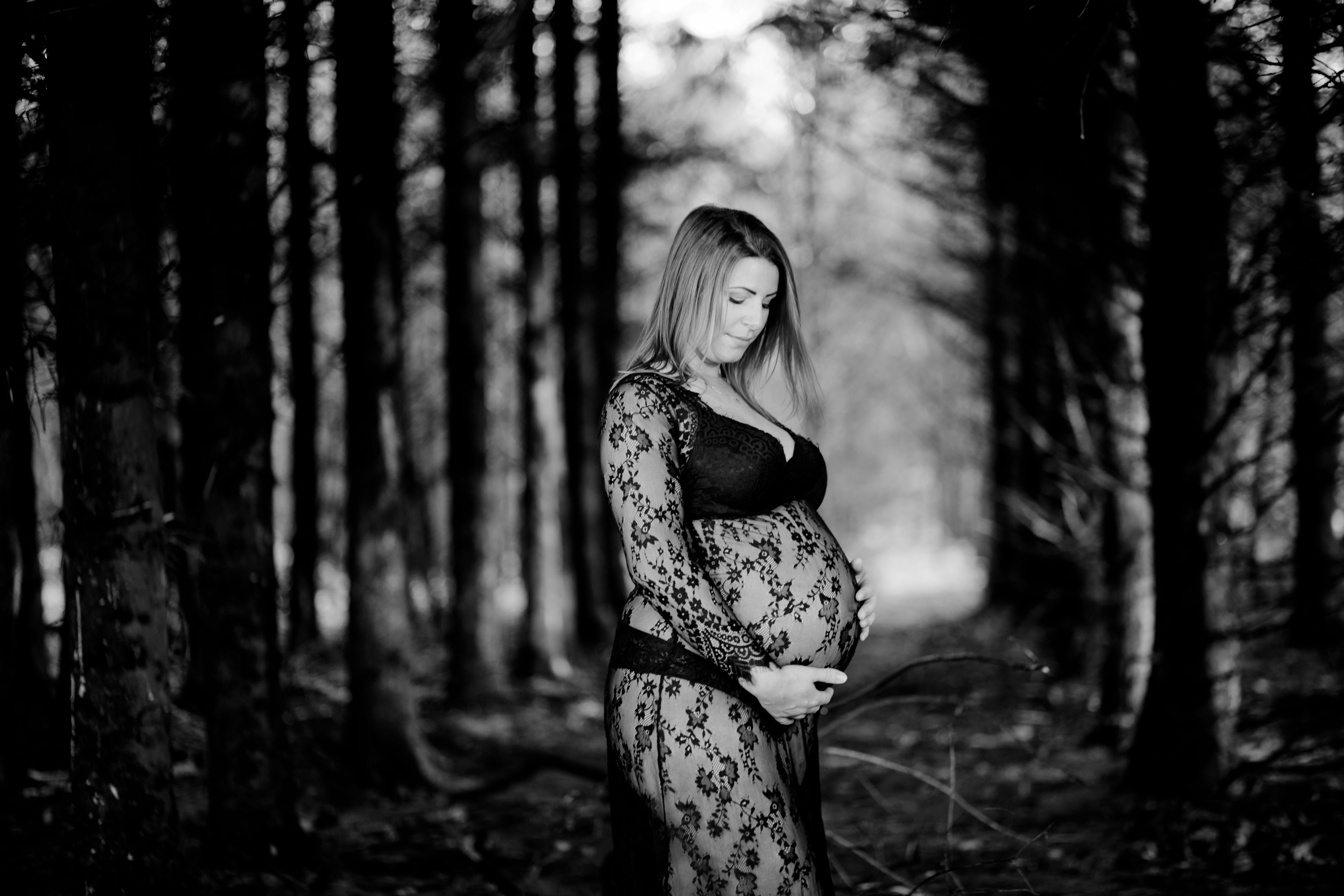 Expecting mother in a beautifully lit maternity portrait