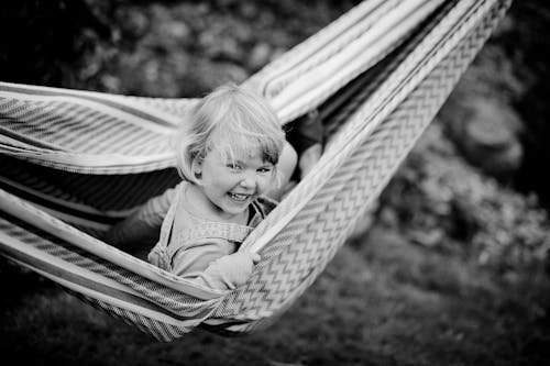 Grayscale Photo of Girl on a Hammock