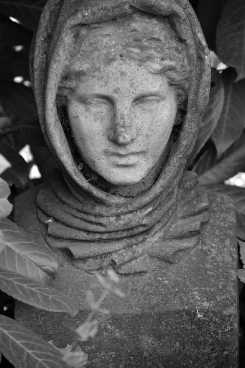 Grayscale Photo of a Woman's Statue Wearing a Headscarf