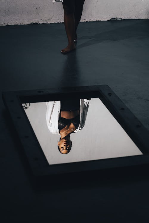 Reflection of a Woman on a Mirror