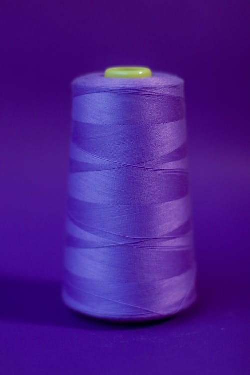 Close-Up Shot of a Purple Thread Roll