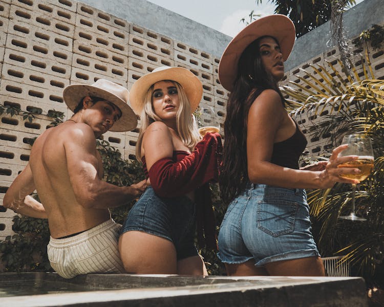 Photograph Of A Group Of Friends With Hats