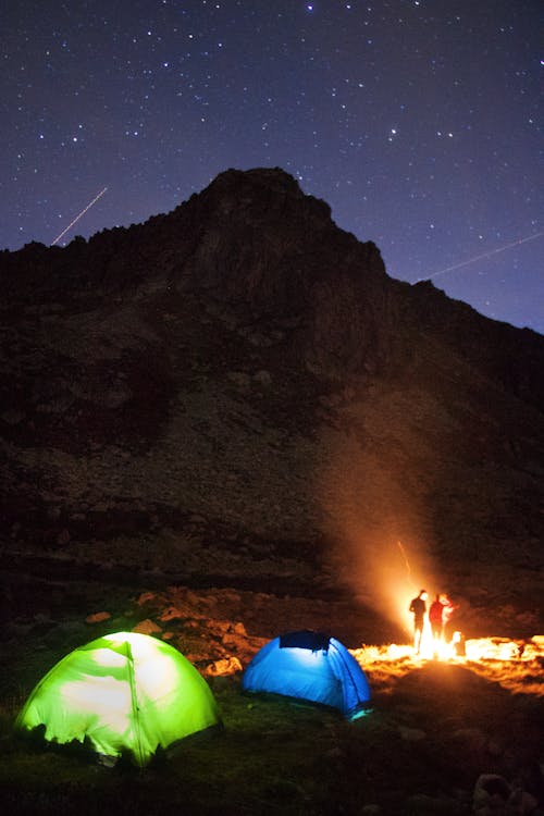 Free A Starry Night Sky over a Campsite Stock Photo