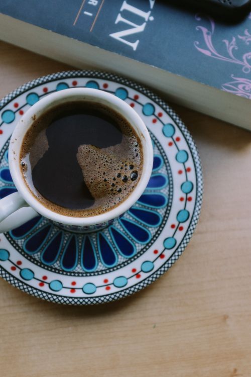 Free Elegant coffee cup on a decorative saucer, perfect for cozy ambiance. Stock Photo