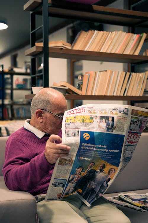 Free Man Reading Newspaper Stock Photo