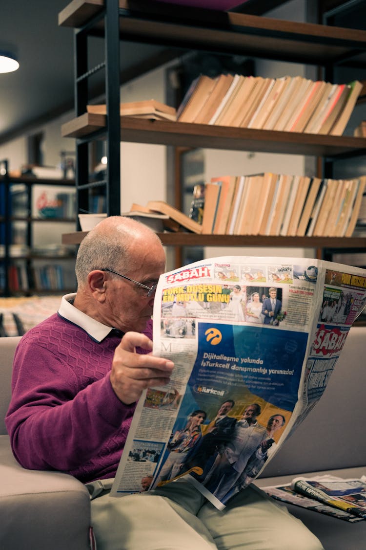 Man Reading Newspaper