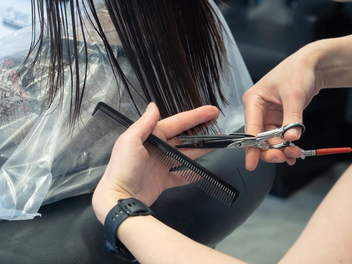 Stylist cutting hair in the salon