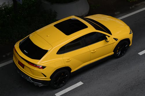 Yellow Car Parked on Road