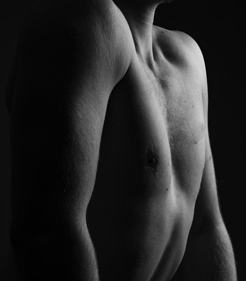 Black and White Photo of a Man's Chest