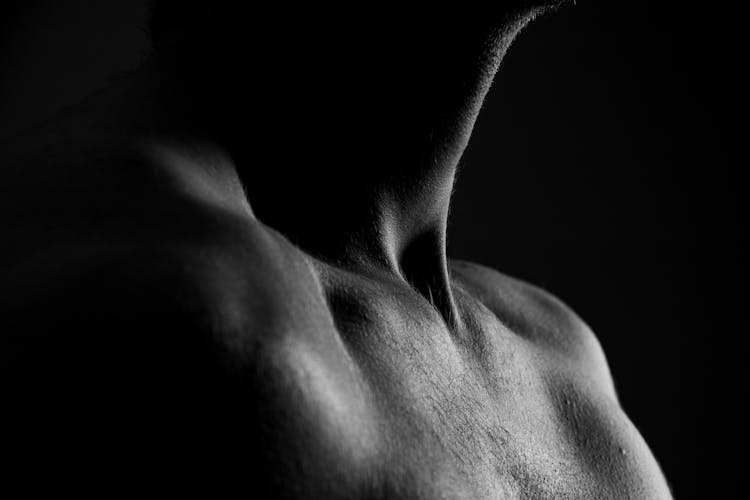 Grayscale Photo Of Neck