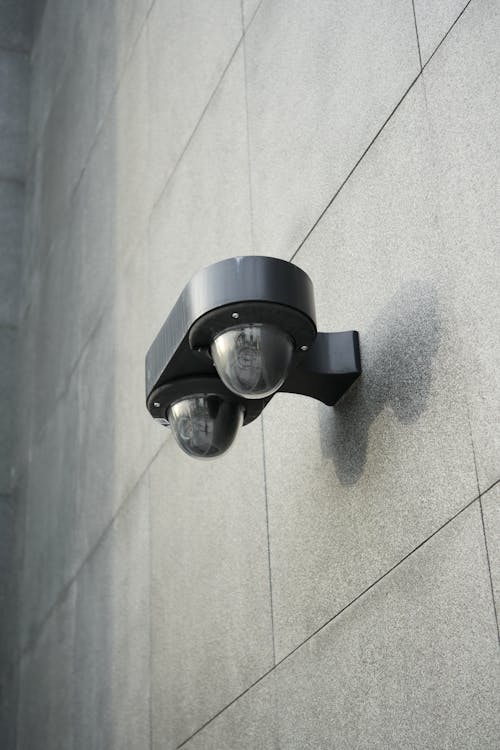 Black Motion Sensor on Gray Wall