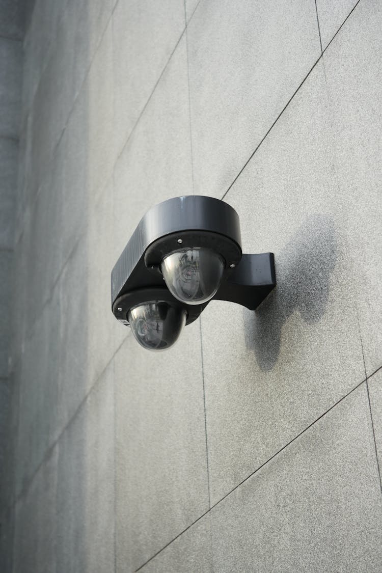 Black Motion Sensor On Gray Wall