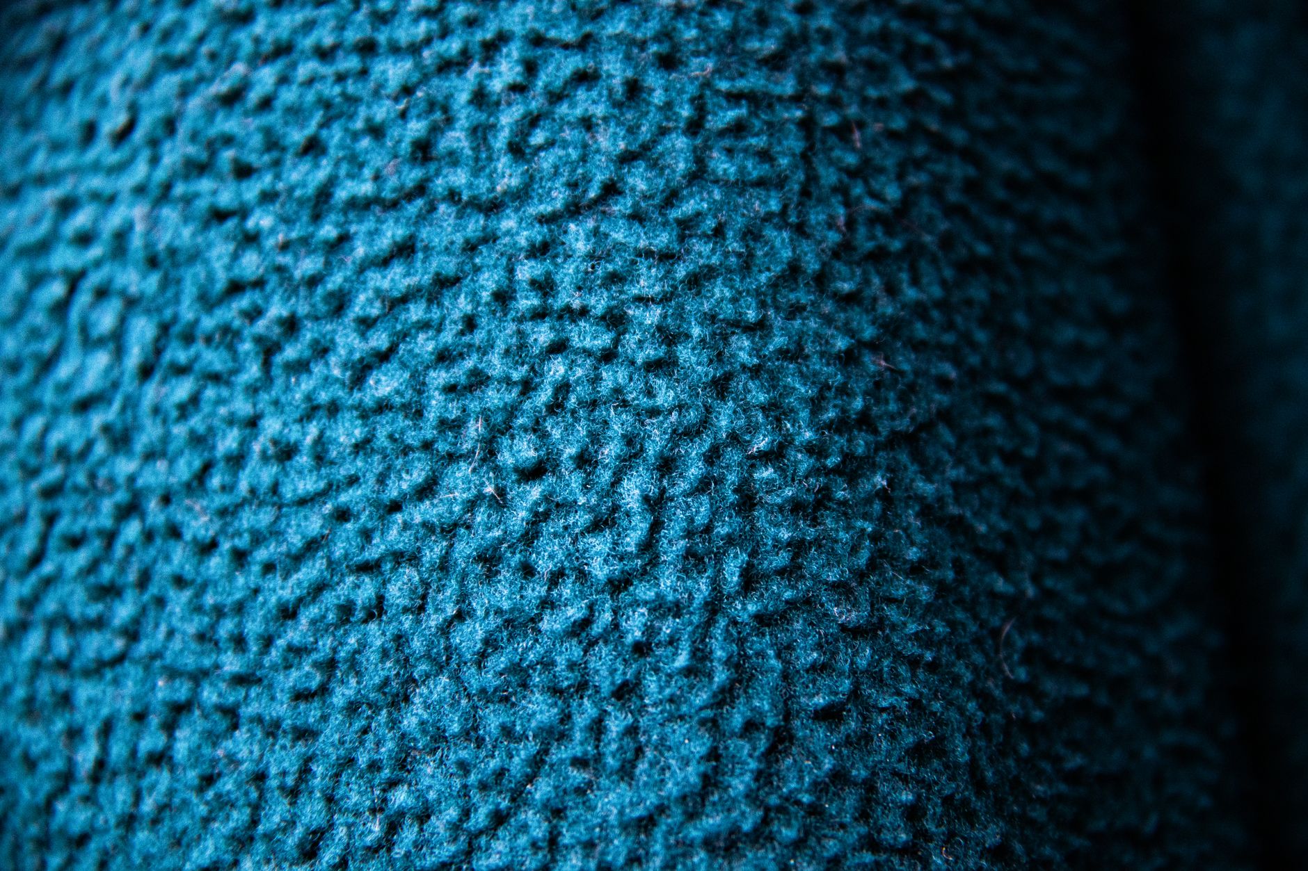 Fabric surface close-up from pilling resistance test showing surface fuzz formation — the type of result used to compare blazer performance across budget, mid-range, and investment tiers