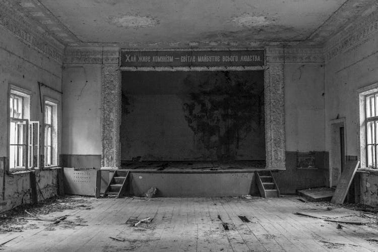 Abandoned Room With Stage In Black And White