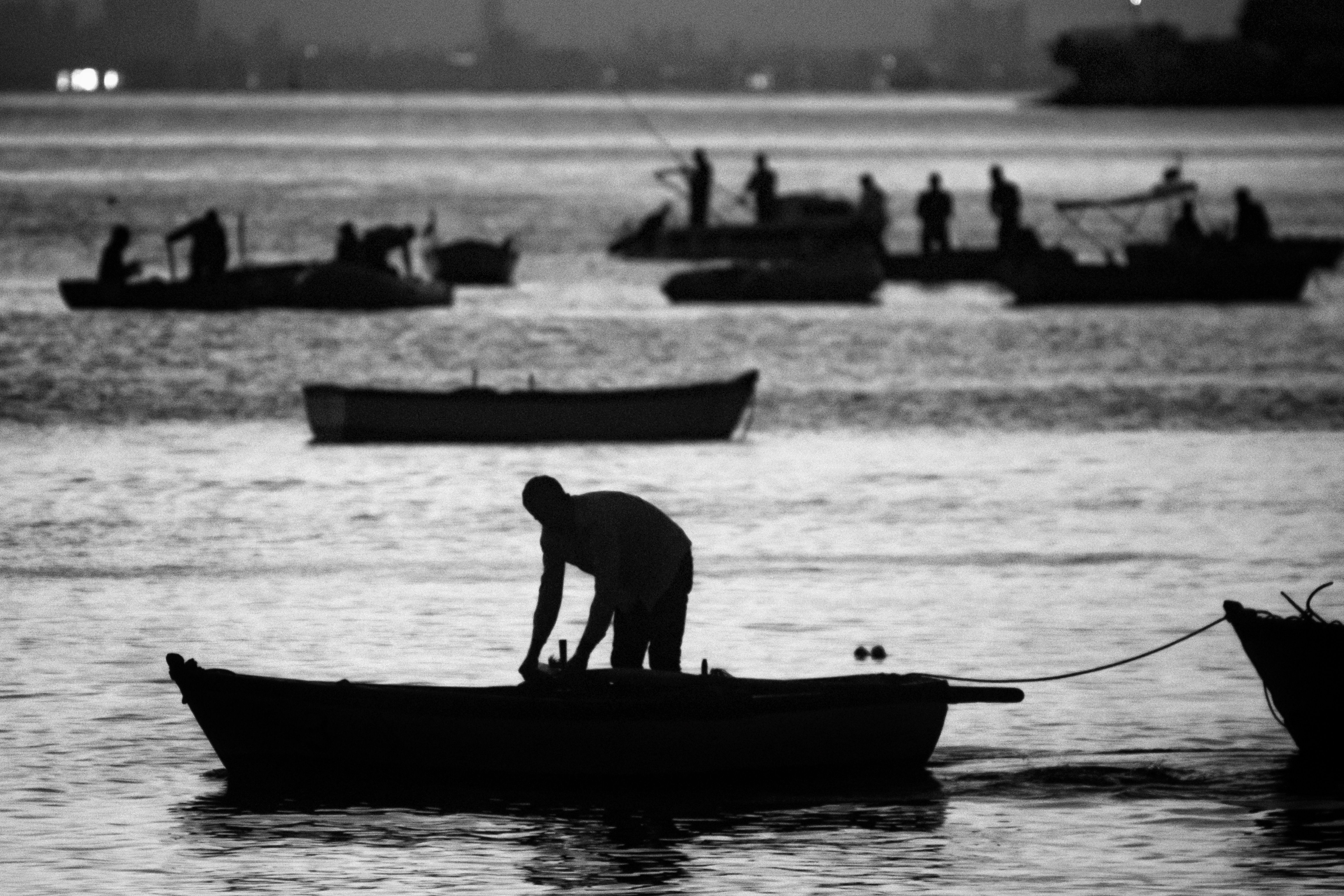 Silhouette of Man Riding on Boat · Free Stock Photo