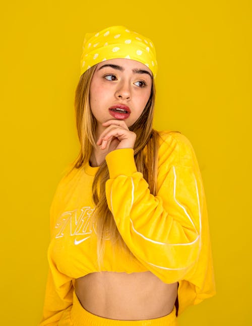 Portrait of a Female Model Posing in Yellow Street Clothing