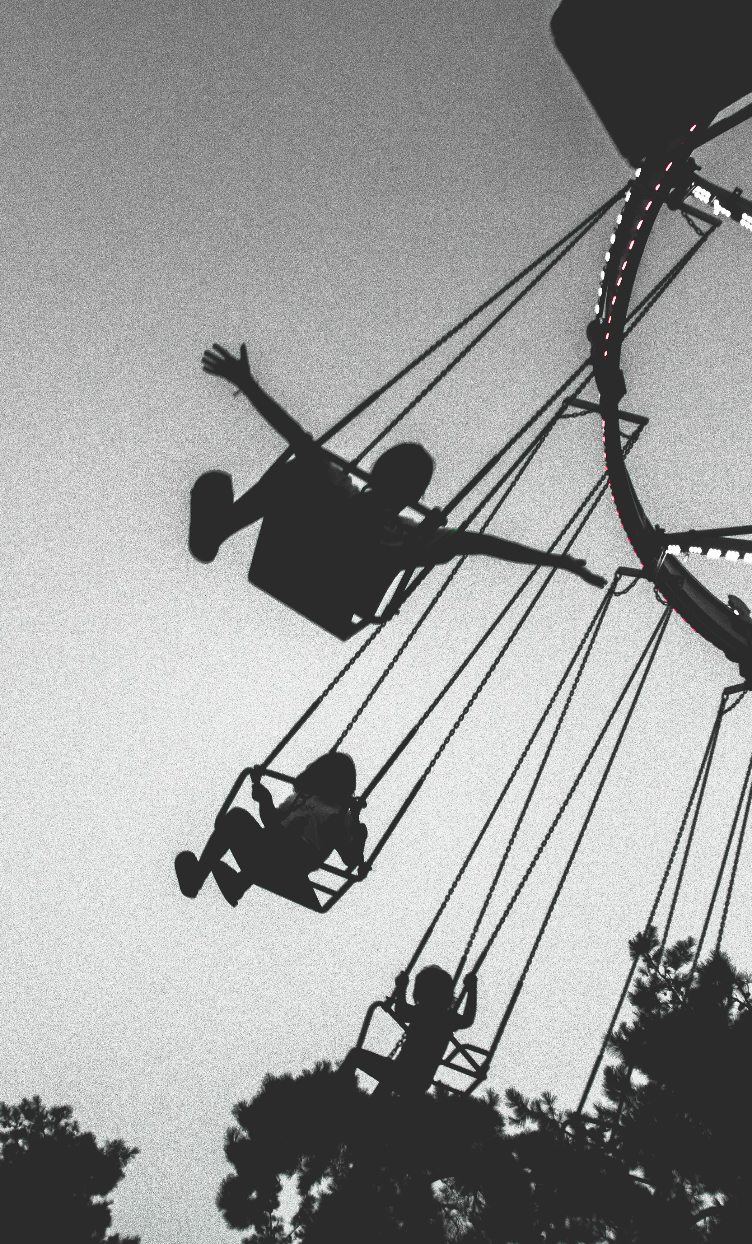 People Riding a Swing Ride · Free Stock Photo