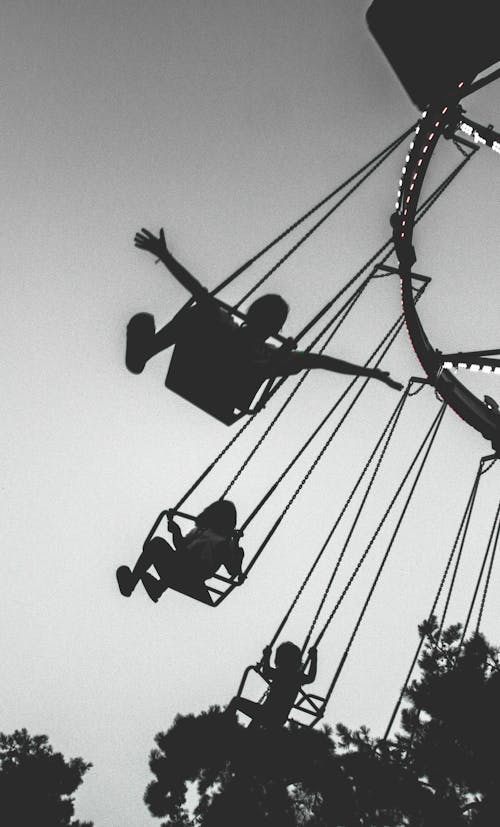 People Riding a Swing Ride