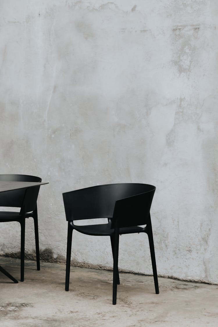 Photo Of A Black Chair Near A Wall