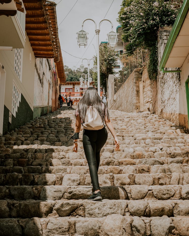 Woman Walking Upstairs