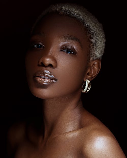 Beautiful Woman with Short Blonde Hair Posing in Studio 