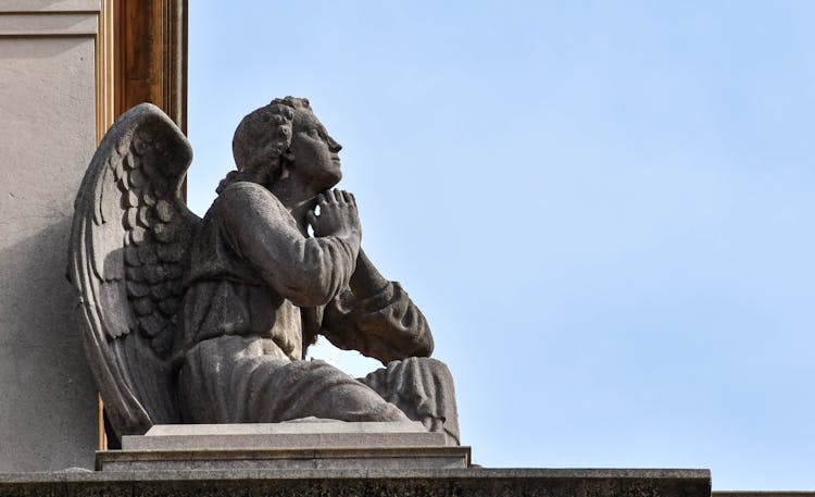 Close-up Of A Praying Angel Statue