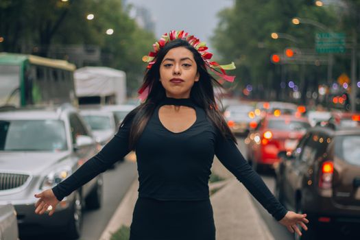  Mexican girl, young and beautiful with a hairstyle that simulates Michoacán dolls or also known as Amealco dolls on Reforma Street in Mexico City.