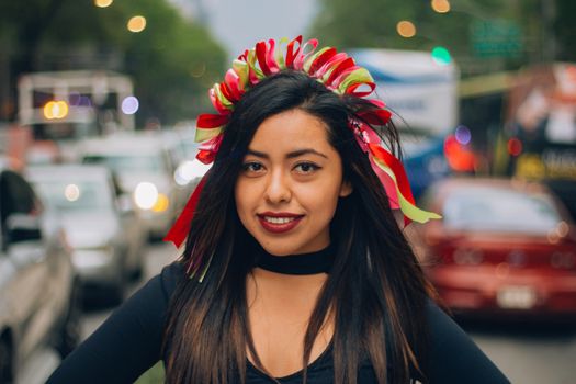  Mexican girl, young and beautiful with a hairstyle that simulates Michoacán dolls or also known as Amealco dolls on Reforma Street in Mexico City.