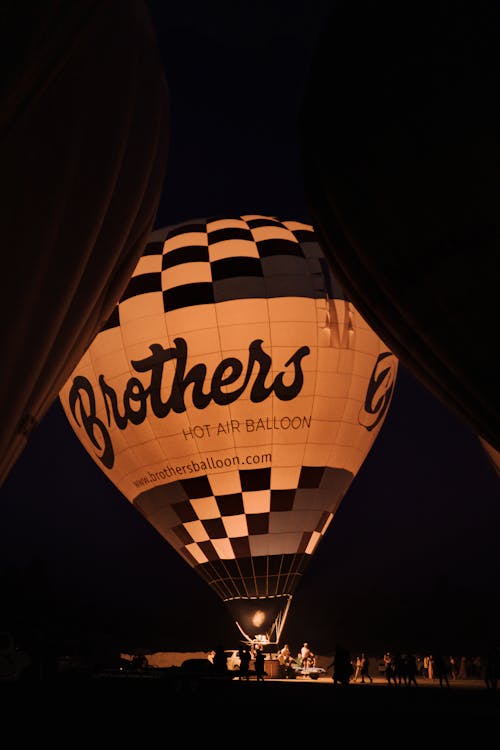 Grayscale Photo of a Hot Air Balloon at Night