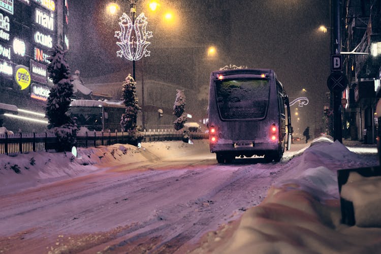 Bus On A City Street In Heavy Snow 