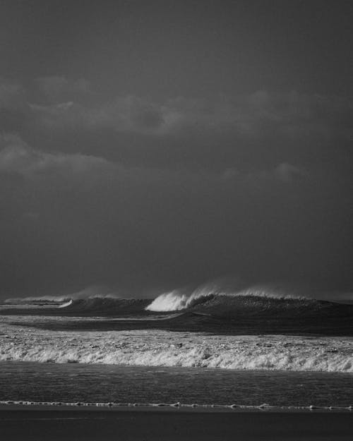 Grayscale Photo of Waves at Sea