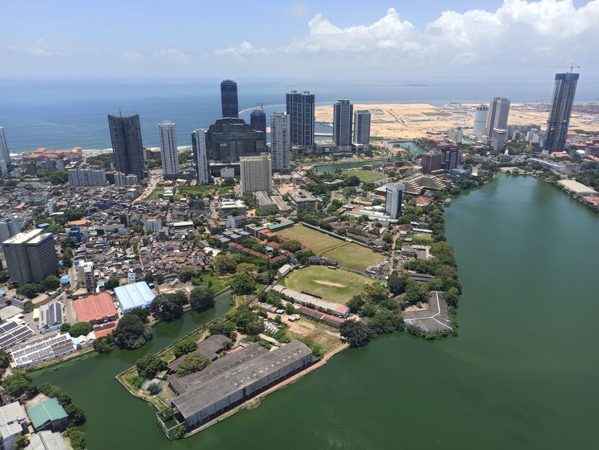 Stunning aerial view capturing Colombo's skyline, oceanfront, and Beira Lake.