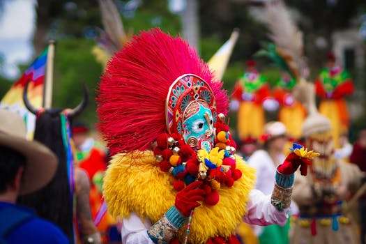 Colorful traditional costume dance at festival in Bogotá with vibrant masks and feathers.