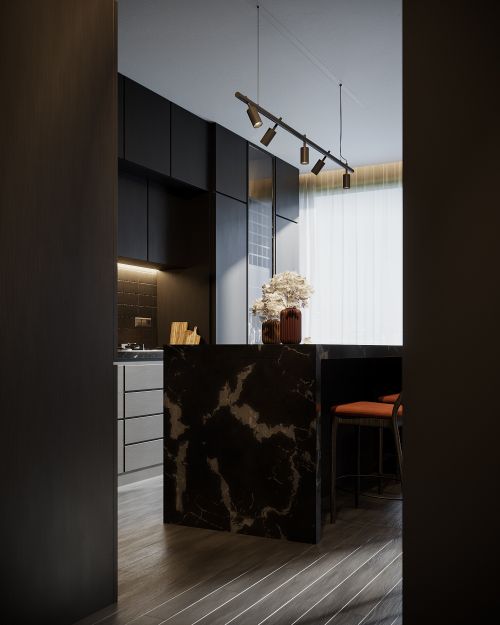 Free Sleek modern kitchen interior featuring a marble island, dark cabinets, and elegant lighting. Stock Photo