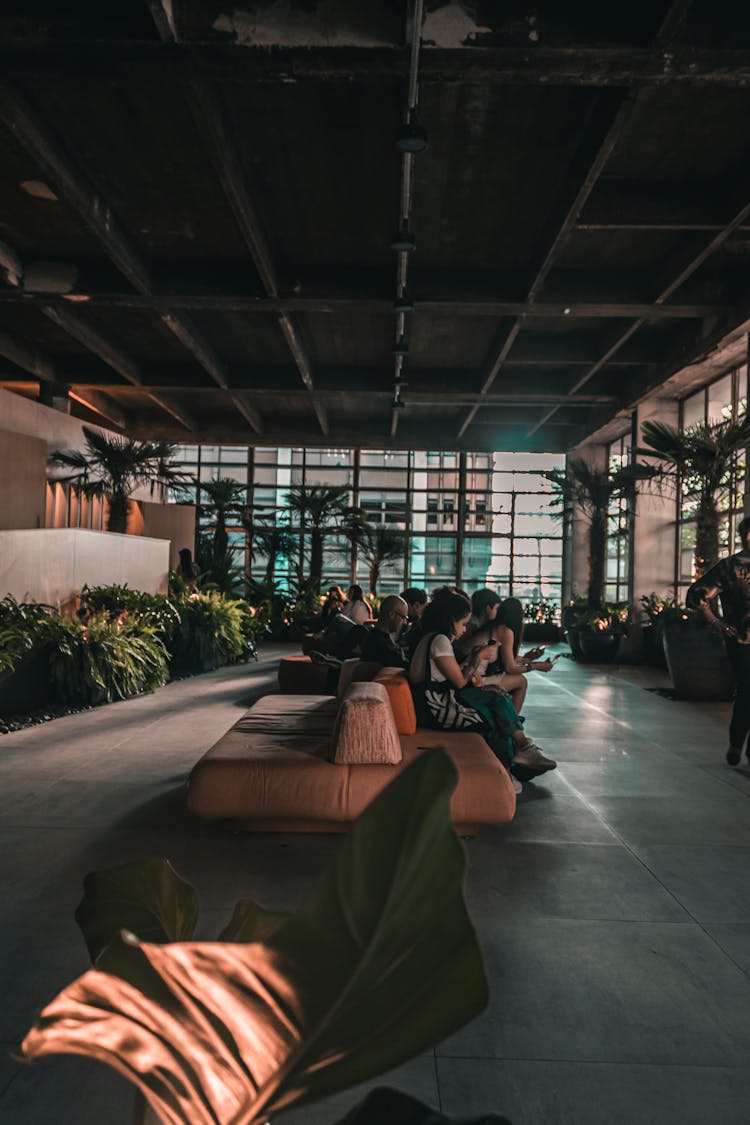 People Sitting On Couch In Waiting Lounge