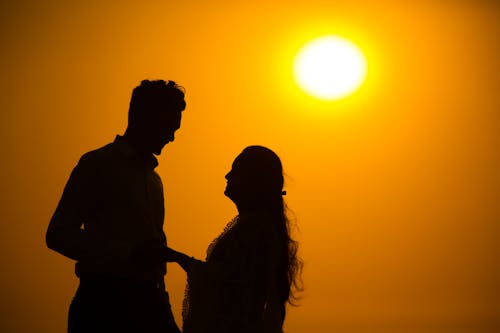 A Silhouette of a Couple during the Golden Hour