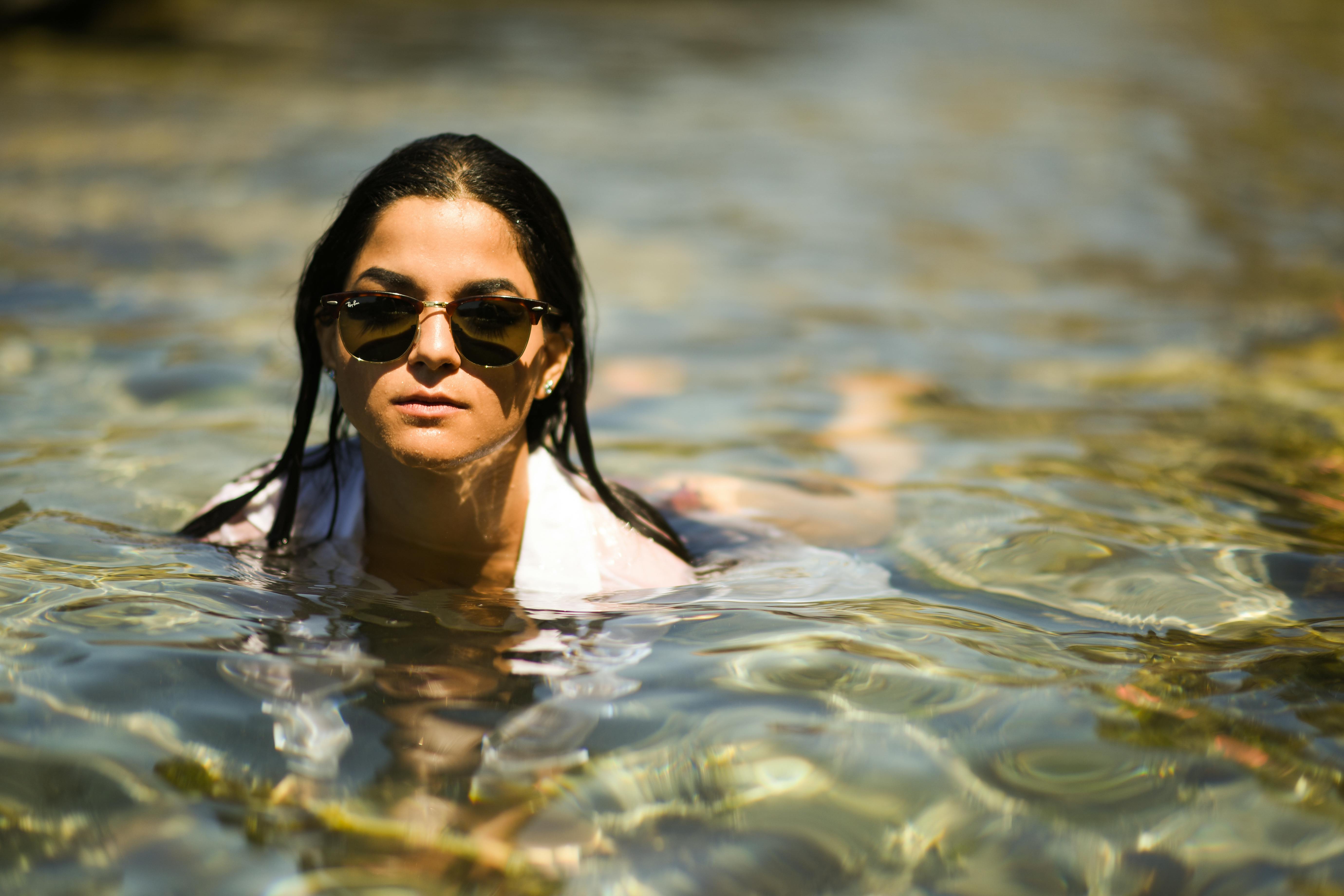 Woman Wearing Black Sunglasses in Water · Free Stock Photo
