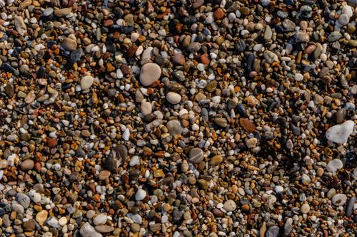Free A vibrant close-up of colorful pebbles on a beach in Side, Antalya, Turkey. Stock Photo