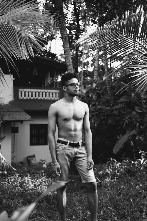 Grayscale Photo of a Shirtless Man