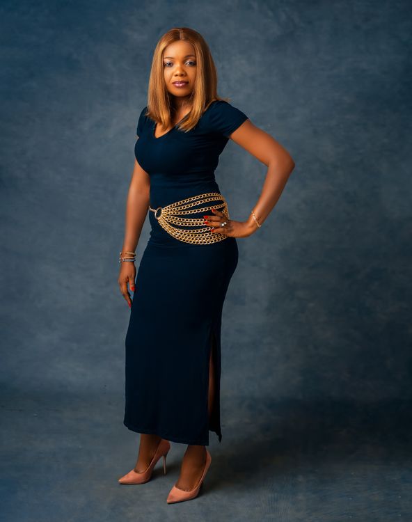 Photo of a Woman in a Blue Dress Posing with Her Hand on Her Waist Free Stock Photo Photo of a Woman in a Blue Dress Posing with Her Hand on Her Waist Free Stock Photo