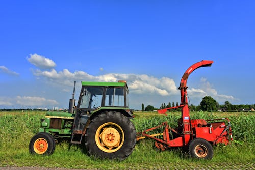 A Green Tractor on the Farm Field