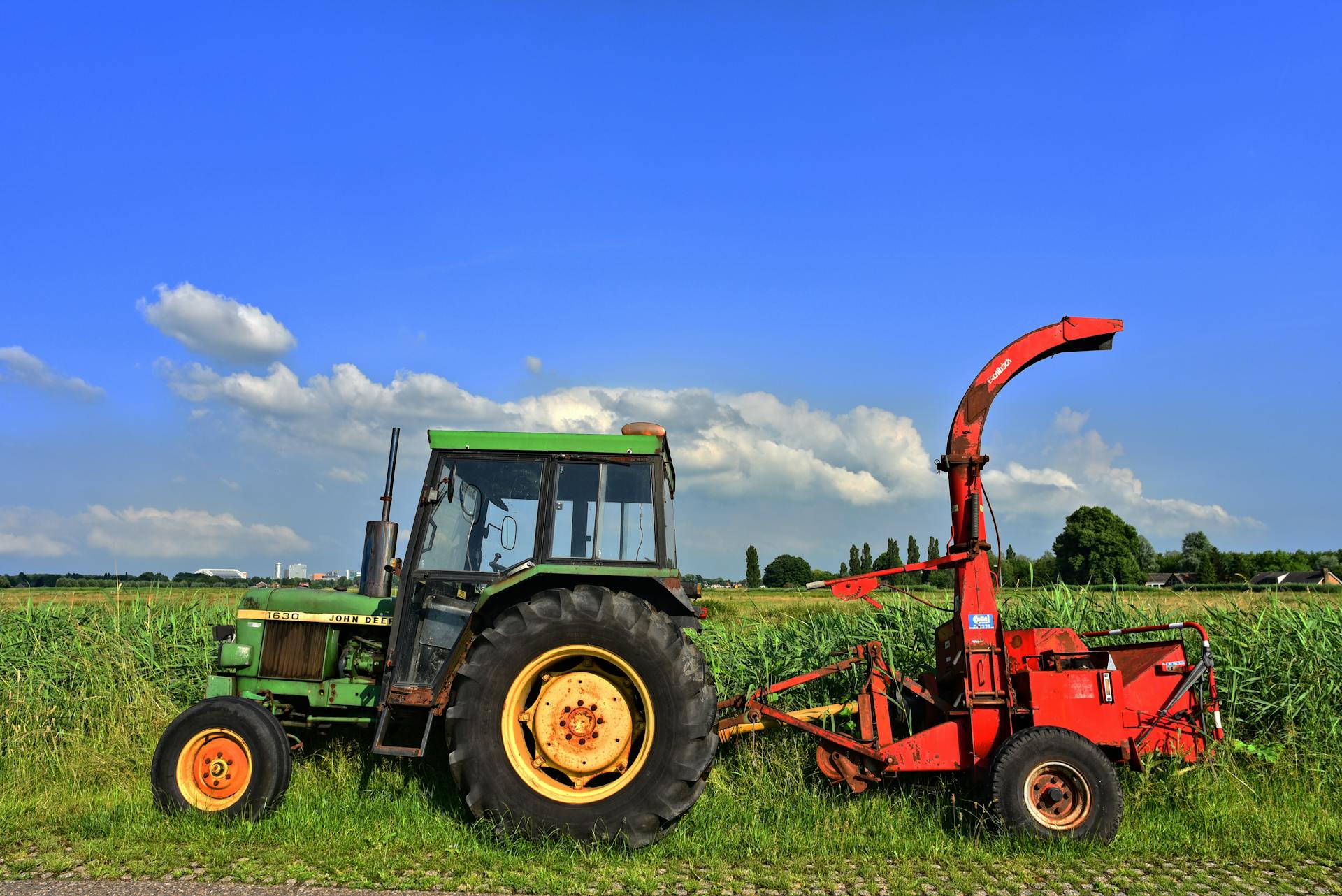 A Green Tractor on the Farm Field