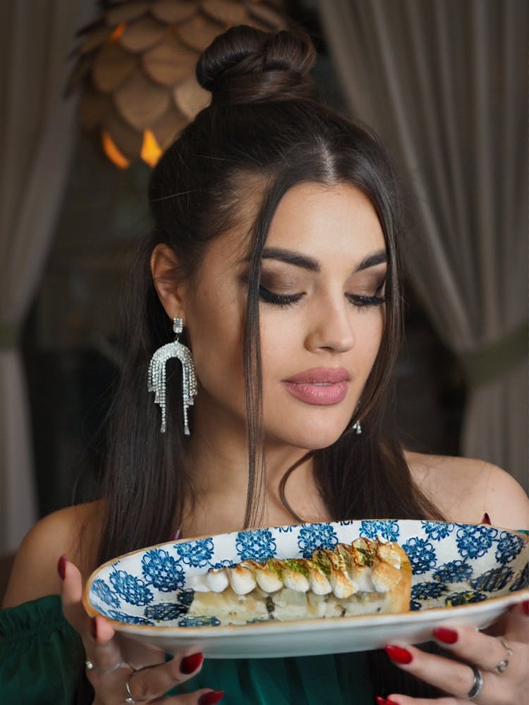 Beautiful Woman Holding Plate With Dessert